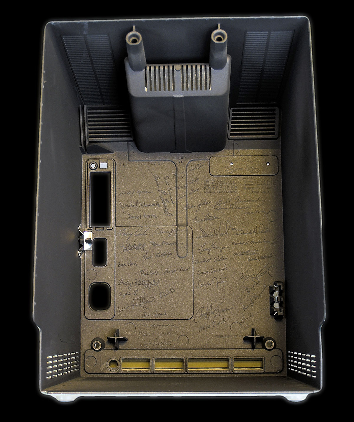 Inside of Original Apple Macintosh case showing signatures molded into the plastic