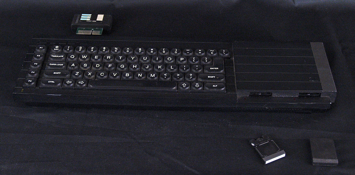 Sinclair QL Computer with expansion card and tape cartridge